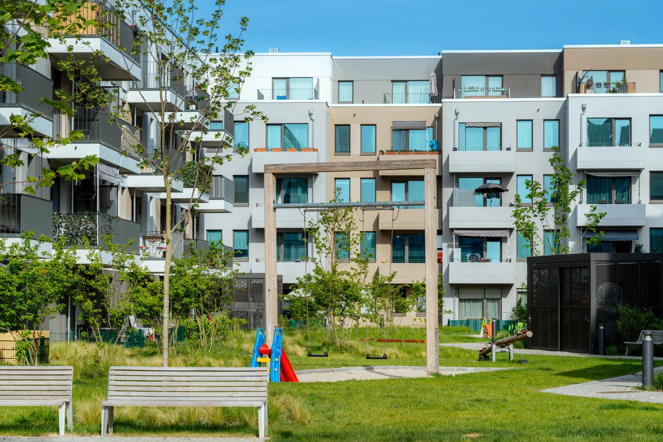 Modern apartment complex exterior representing quality residential property options